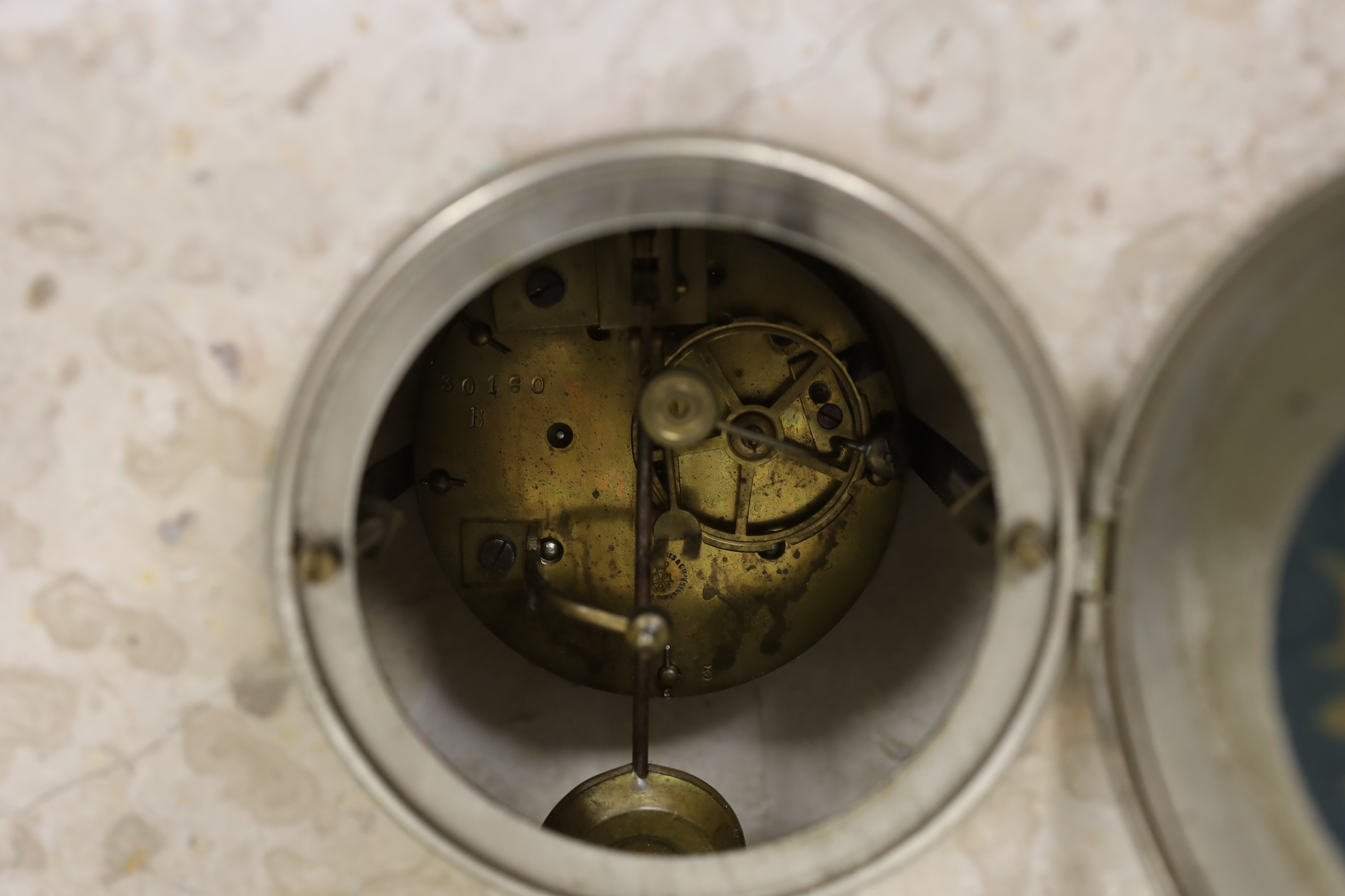 A French Art Deco onyx and spelter mantel clock, signed S. Moralni, with key and pendulum, 39cm